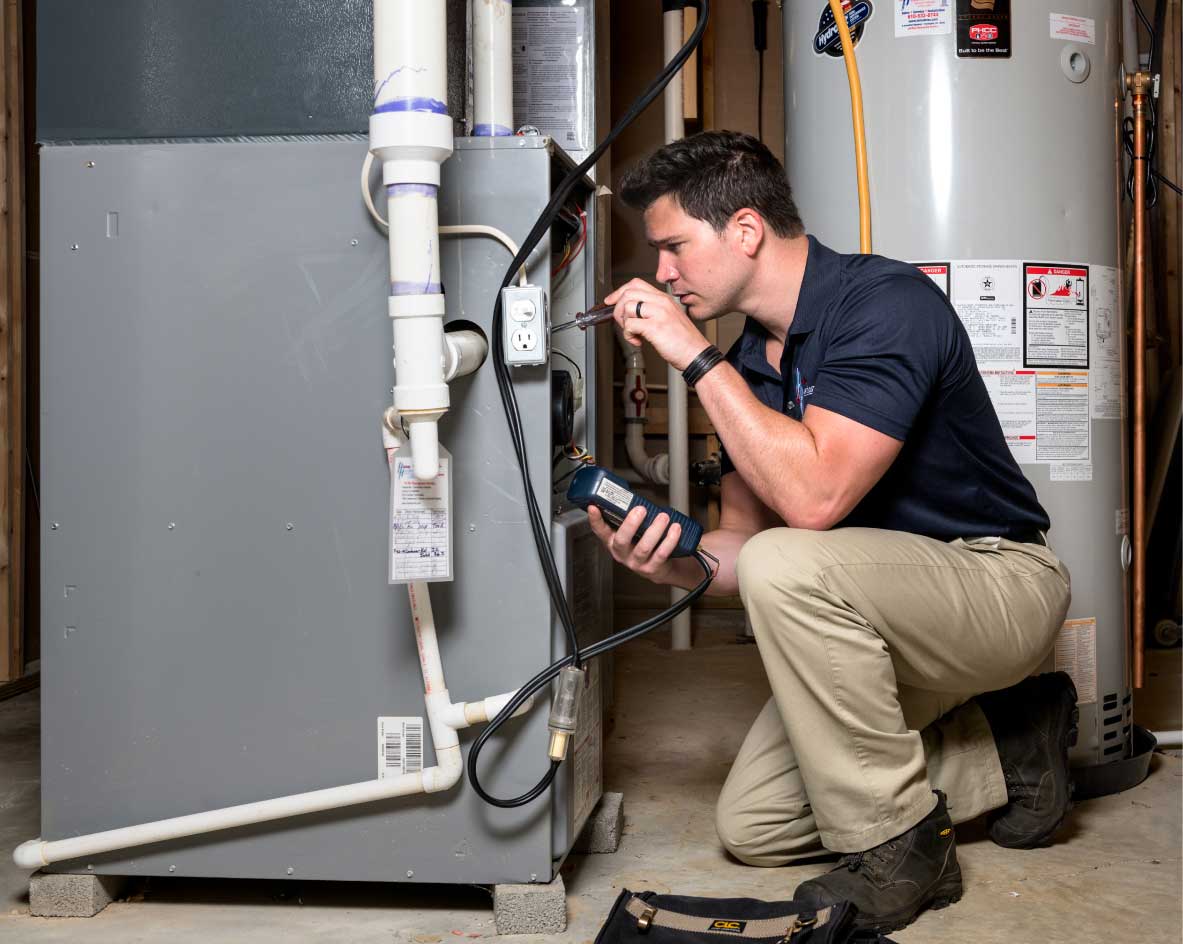 MH Plumbing technician performing furnace diagnostic for furnace repair and replacement