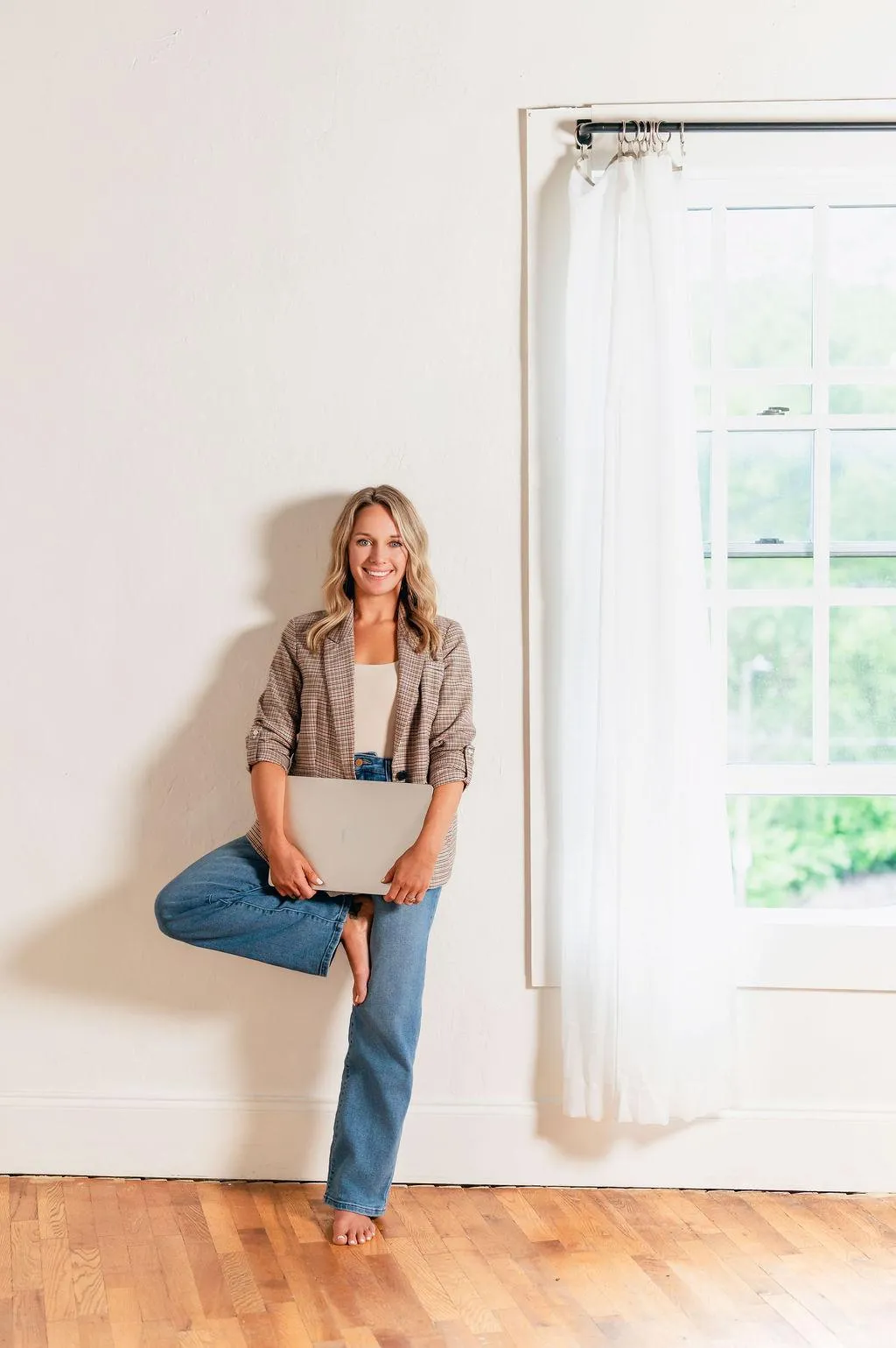 calm body of water surrounded by trees near cliff