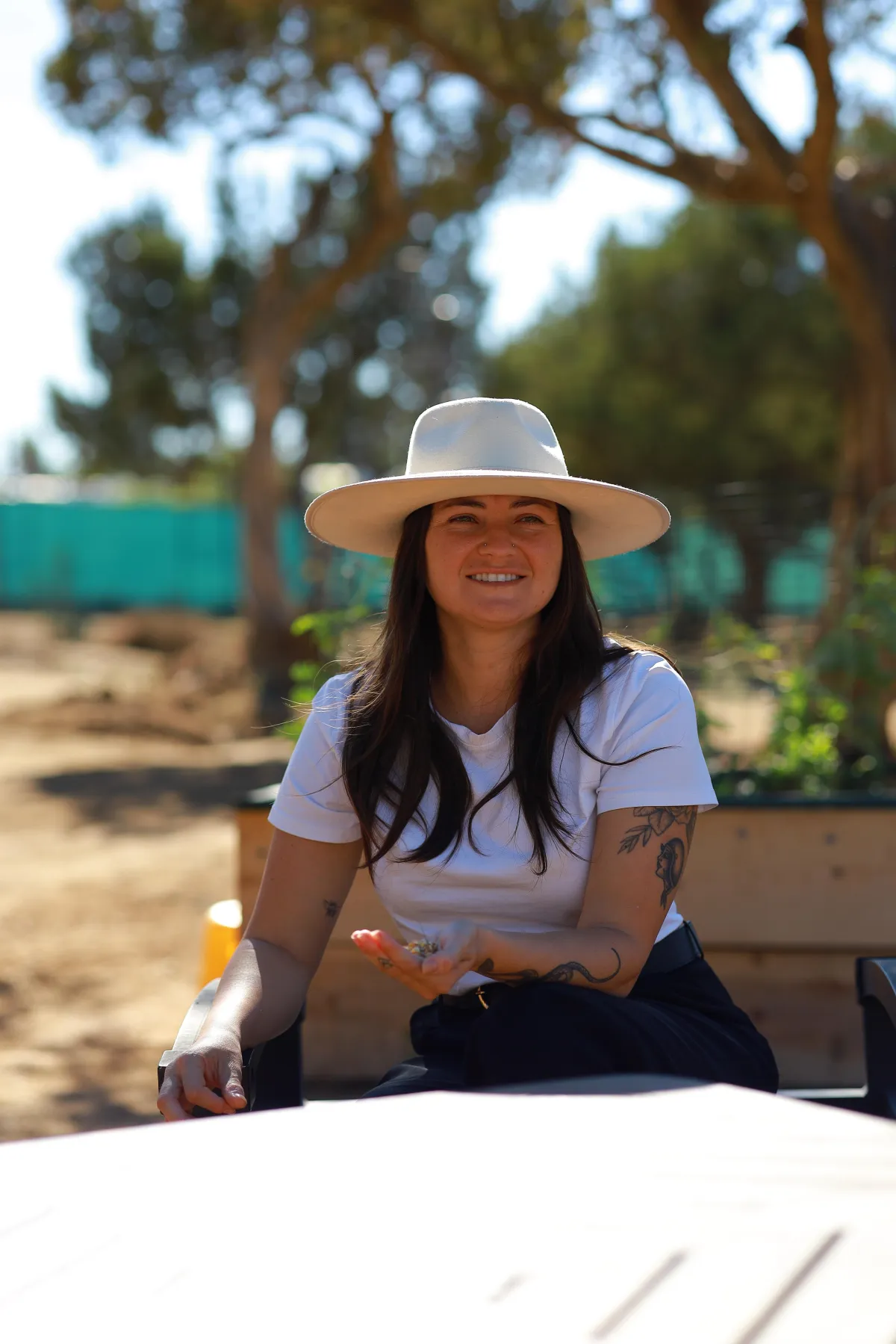 Maggie Scotto feeding the goats.