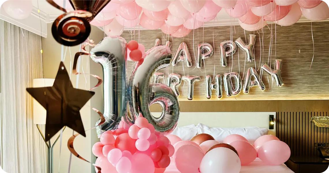Sweet 16 pink and rose gold balloon backdrop with stars and metallics
