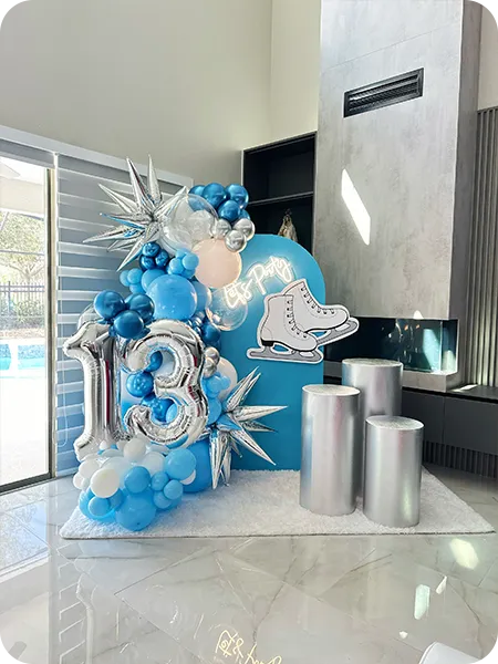 Bold balloon backdrop in icy blue with winter theme