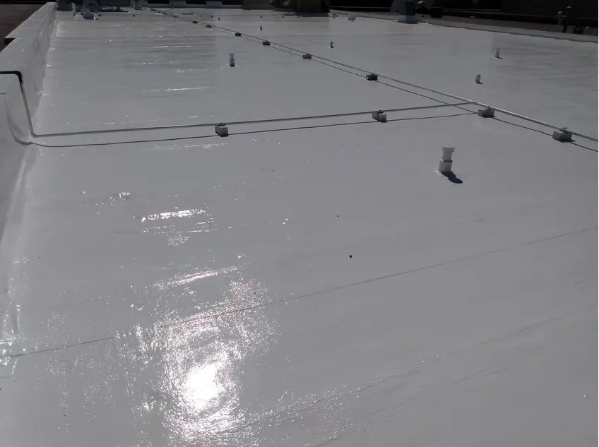 Low-slope roof covered in single ply membrane with HVAC units