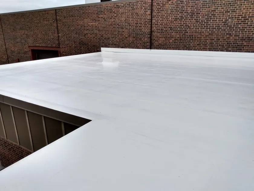 Single ply roofing membrane being installed on low-slope Colorado roof