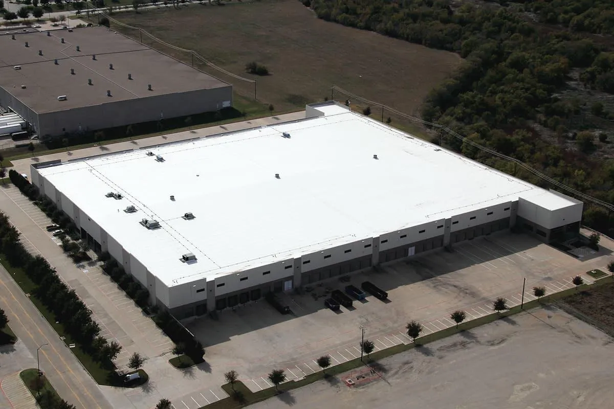 Wide-angle view of a flat commercial roof in progress
