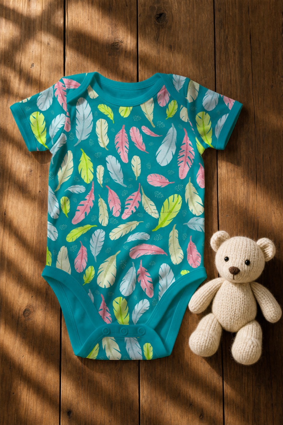 Baby onesie printed with the Feather Your Nest bird repeat pattern