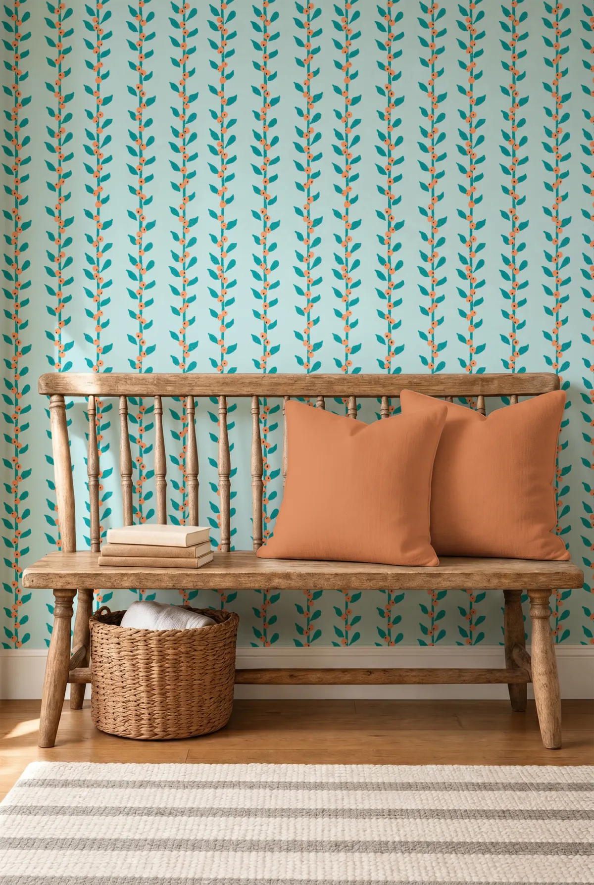 Entryway wallpaper mockup in the Through the Grapevine bird repeat pattern, styled with a bench, throw pillow, and wicker basket.