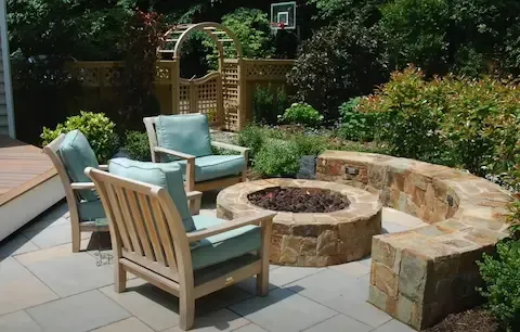 Stone fire pit patio with seating built by Gresham Concrete Services in Gresham OR.