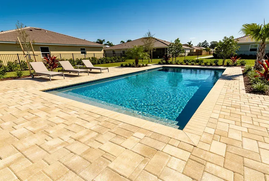Finished paver pool deck with textured non-slip surface at a home in Kendale Lakes, Florida