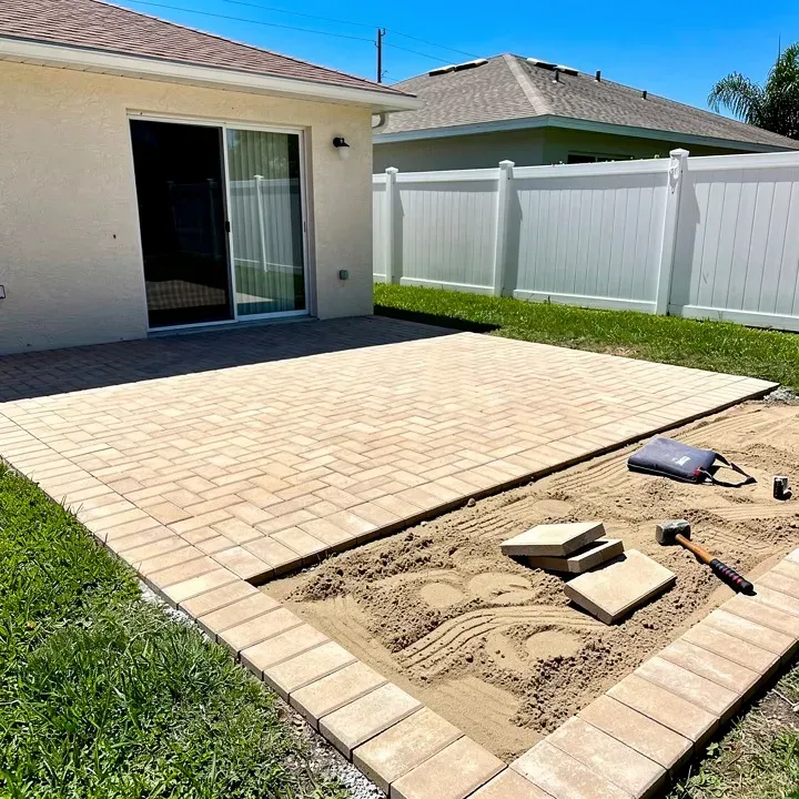 Paver patio installation in progress showing sand base and pavers in Kendale Lakes, Florida