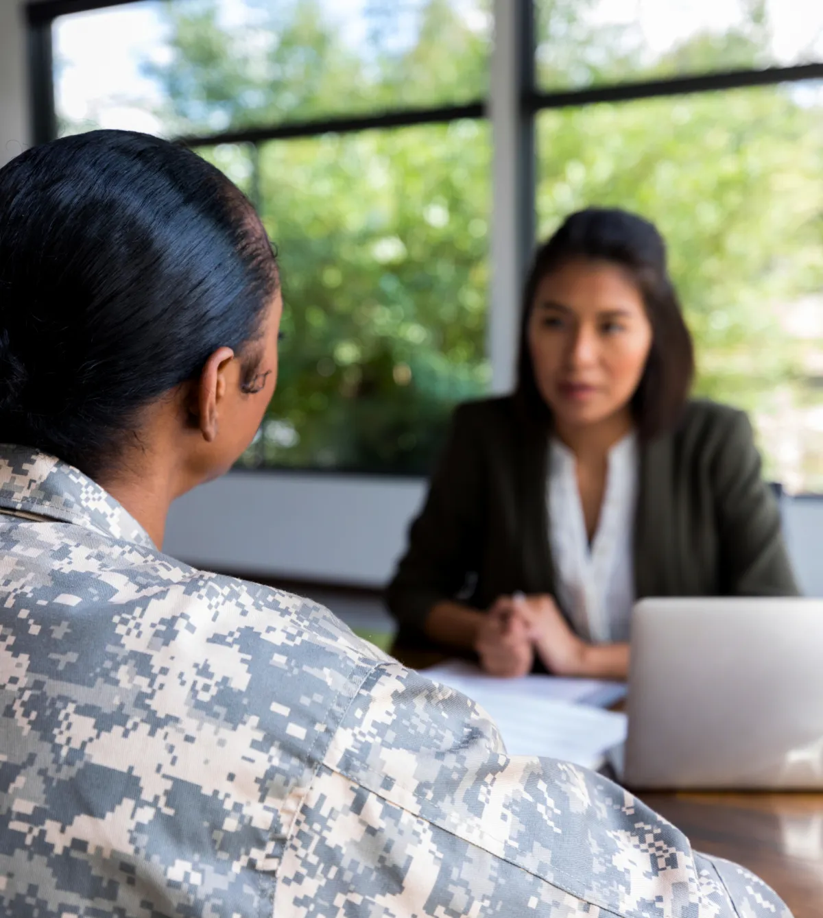 Female military veteran meeting with business consultant about starting a veteran-owned business