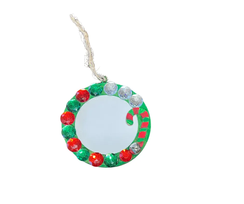 Person taking a picture of a detailed tree artwork.