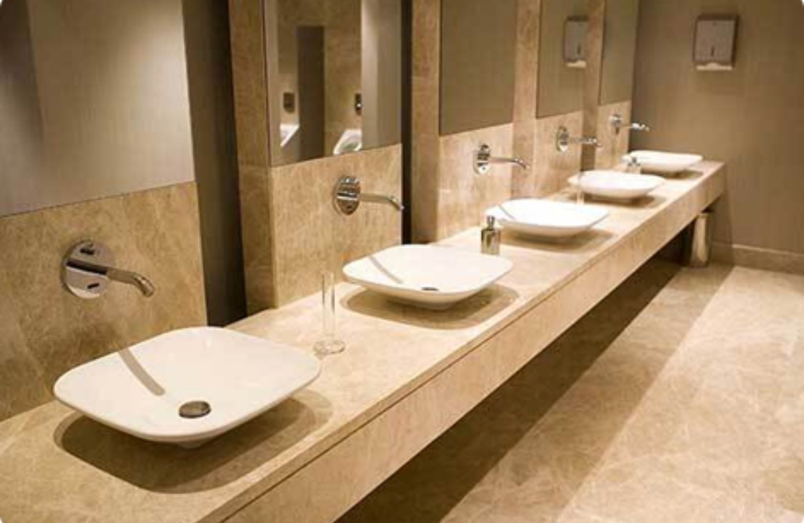 Commercial plumbing services in Houston – clean modern restroom with multiple sinks and fixtures professionally installed