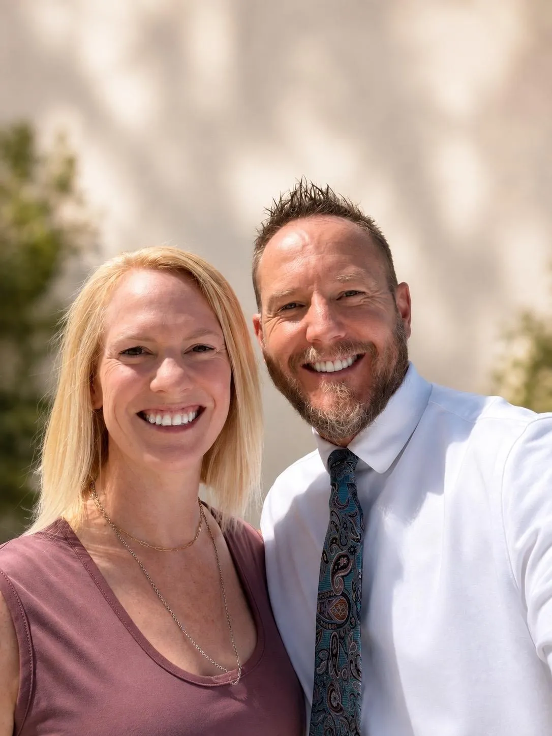 Tim and Becky Graff walking outdoors on a forest path
