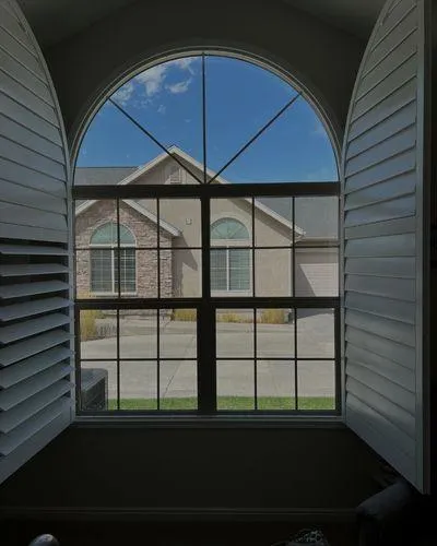 Crystal clear arched windows after professional cleaning by Mountain View Window Washing
