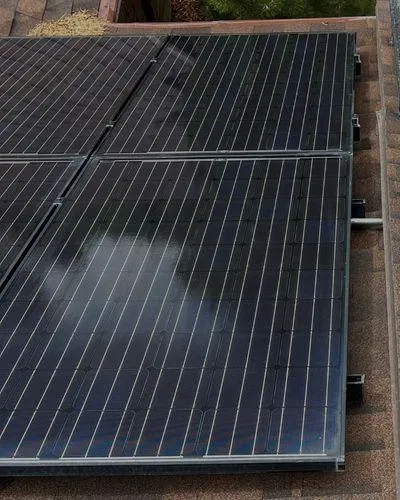 Dirty solar panels before professional cleaning service by Mountain View Window Washing