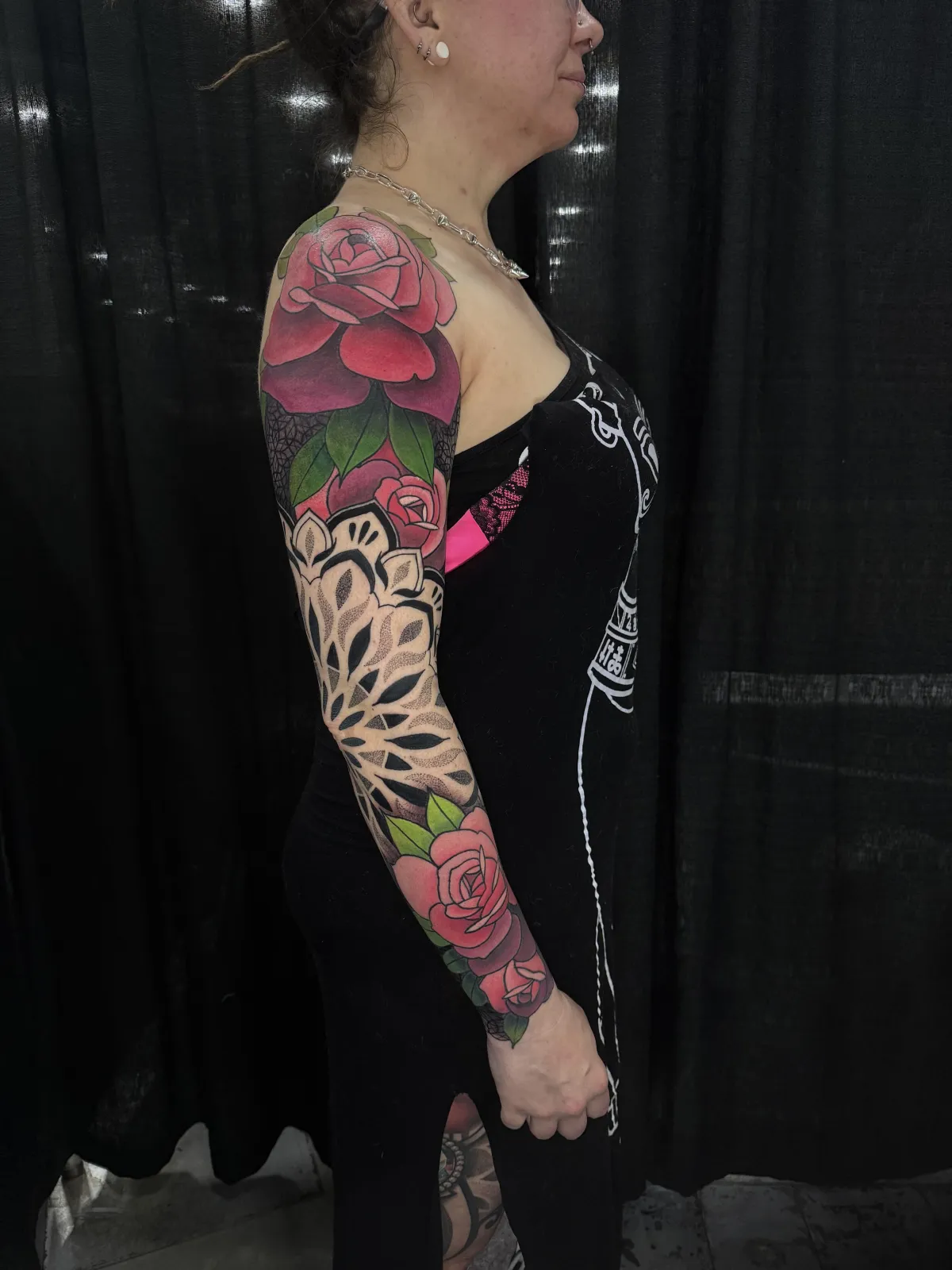 person in blue denim shorts and white nike sneakers standing on gray concrete floor