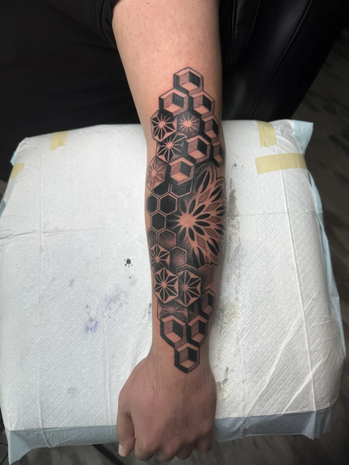 person with tattoo on right arm