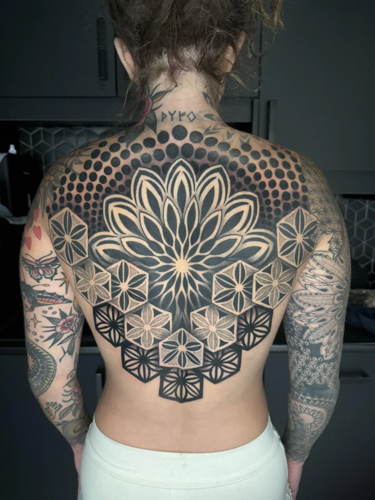 person with tattoo on right arm