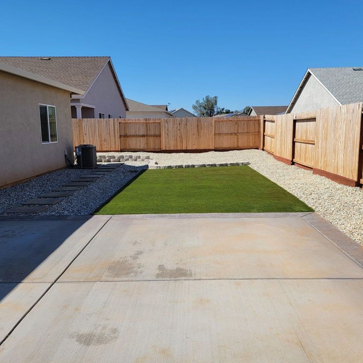 Concrete driveway installation in Redding, CA with clean finish and gravel borders