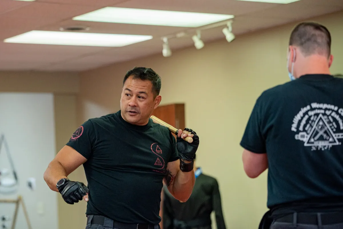Suro Jason Inay teaching a group in Inayan System of Eskrima shirts
