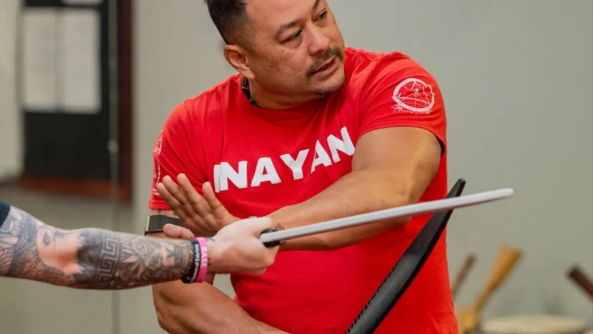 Suro Jason Inay teaching a stick and blade technique