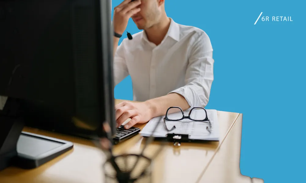 Retail leader reviewing a business system before deciding on a replacement