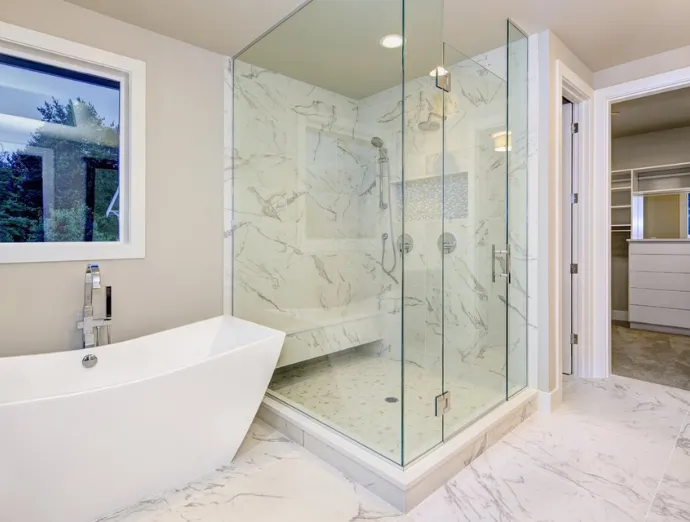 Shower remodel with modern glass enclosure, rainfall showerhead, and stylish tiles in Bridgeton, NJ.