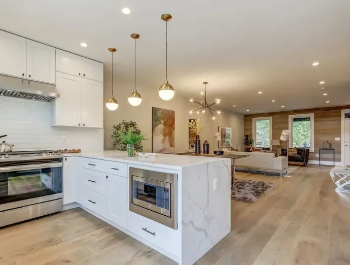 Open concept kitchen remodel with seamless flow between kitchen and living space, featuring a large island in Bridgeton, NJ.