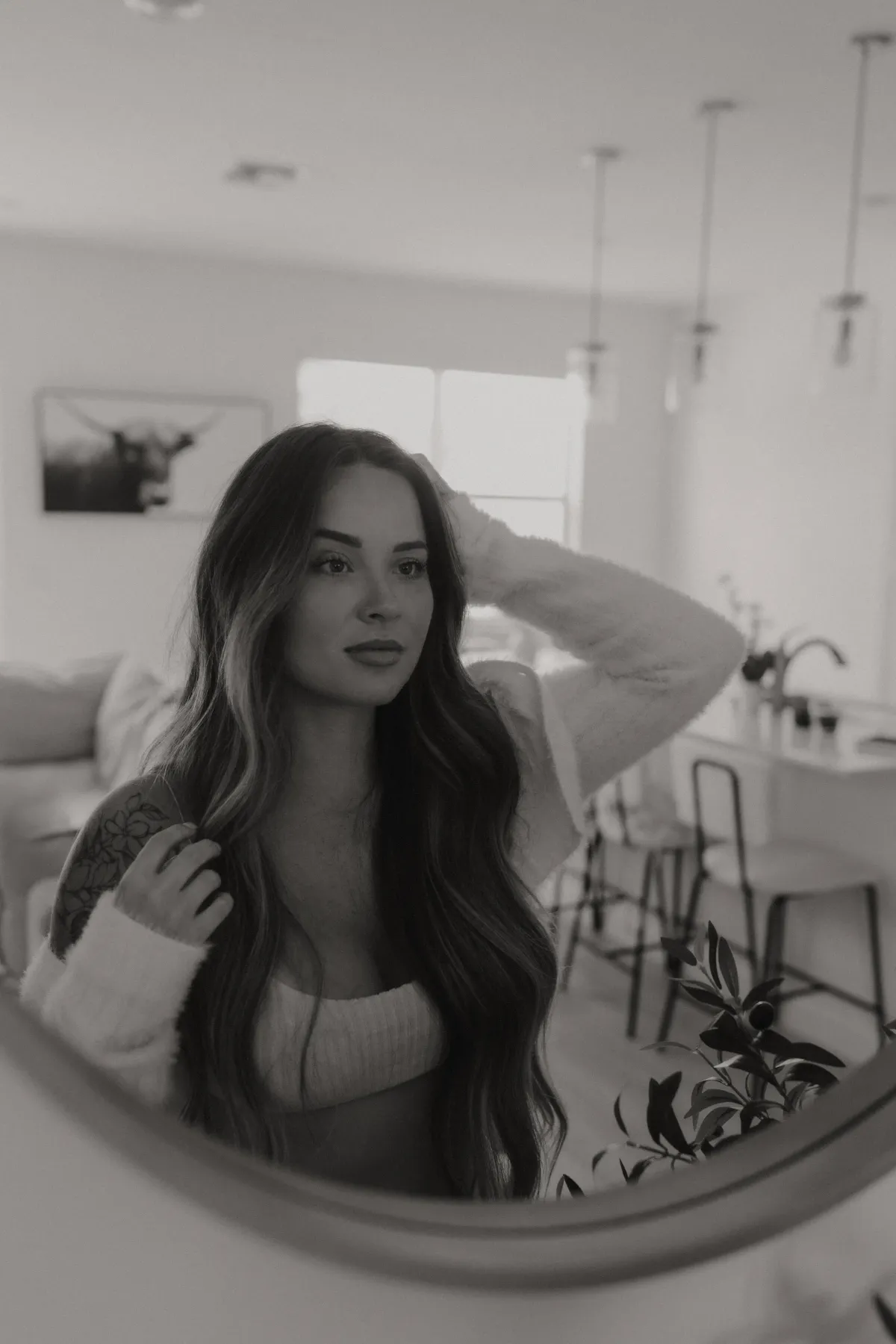 Chelsea Tansey reflecting in the mirror, feeling confident. Here's what you'll get inside.