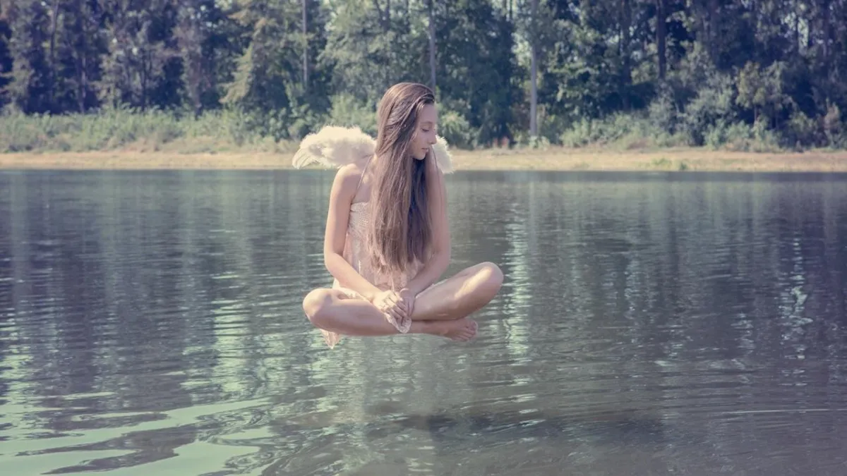 A large body of water sitting next to a rocky shore