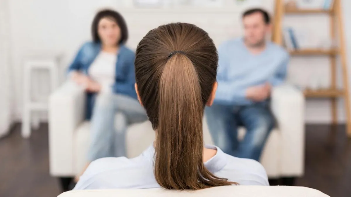A large body of water sitting next to a rocky shore