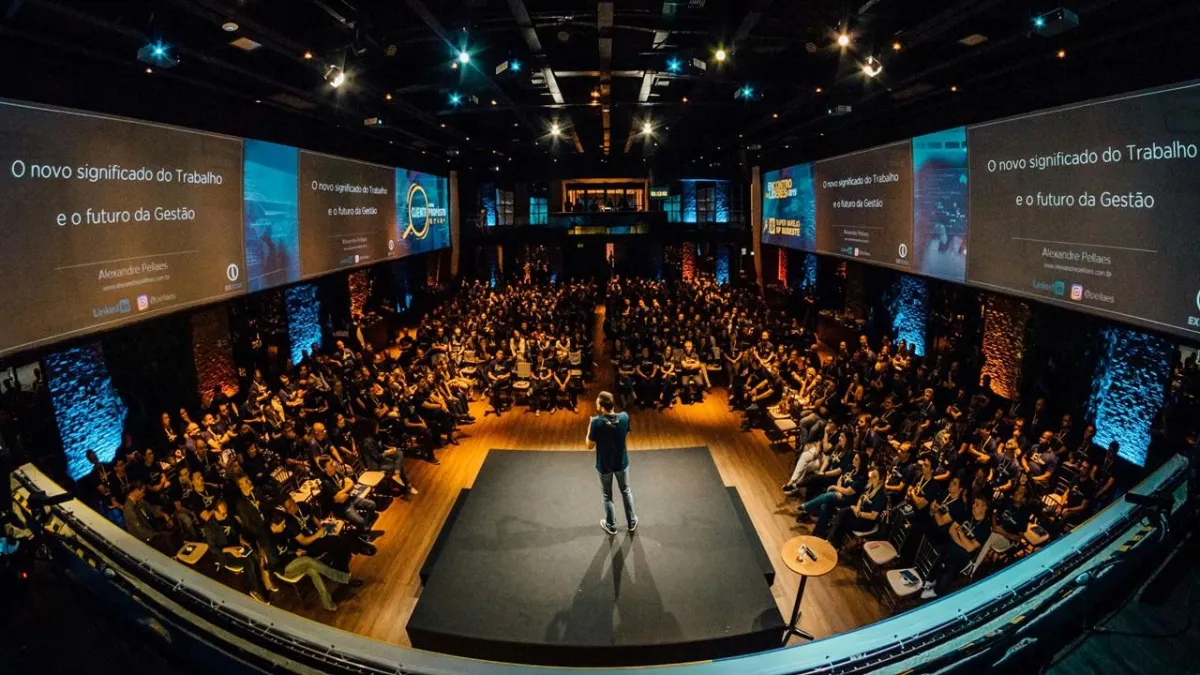 A large body of water sitting next to a rocky shore