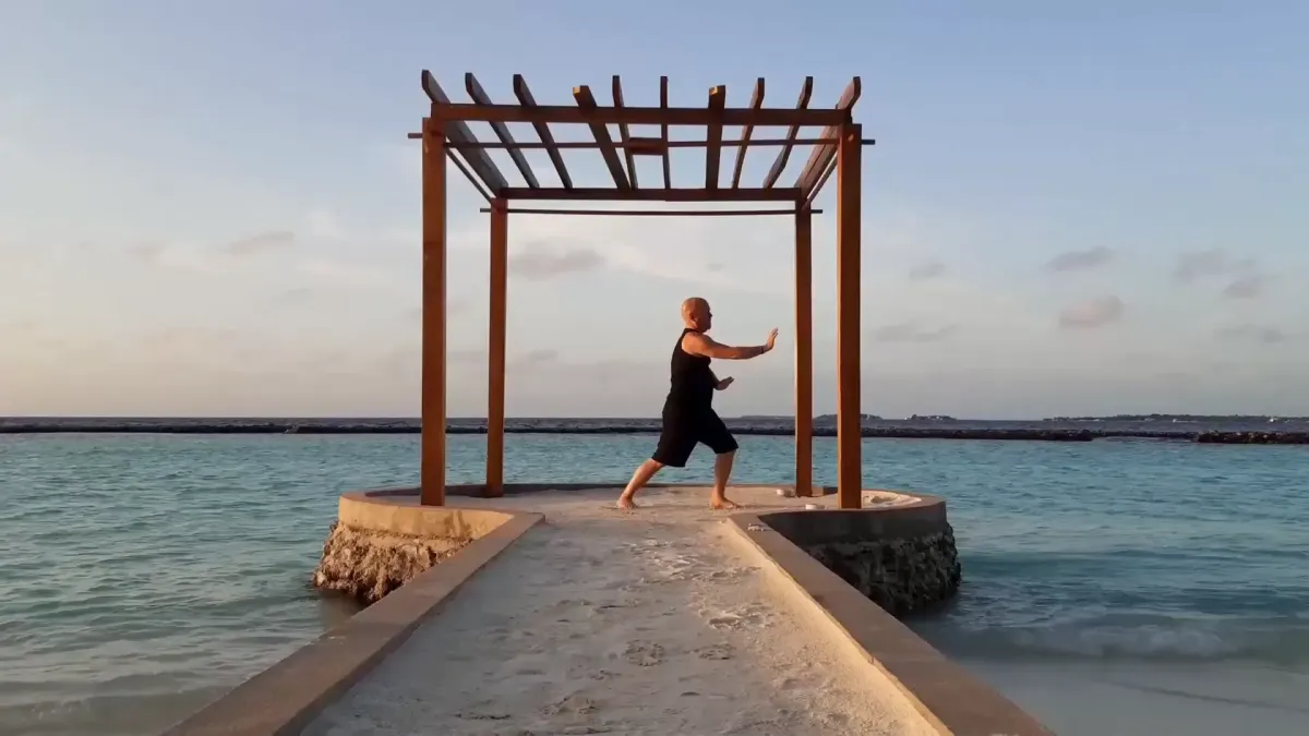Peter practising Qi Gong in the Maldives