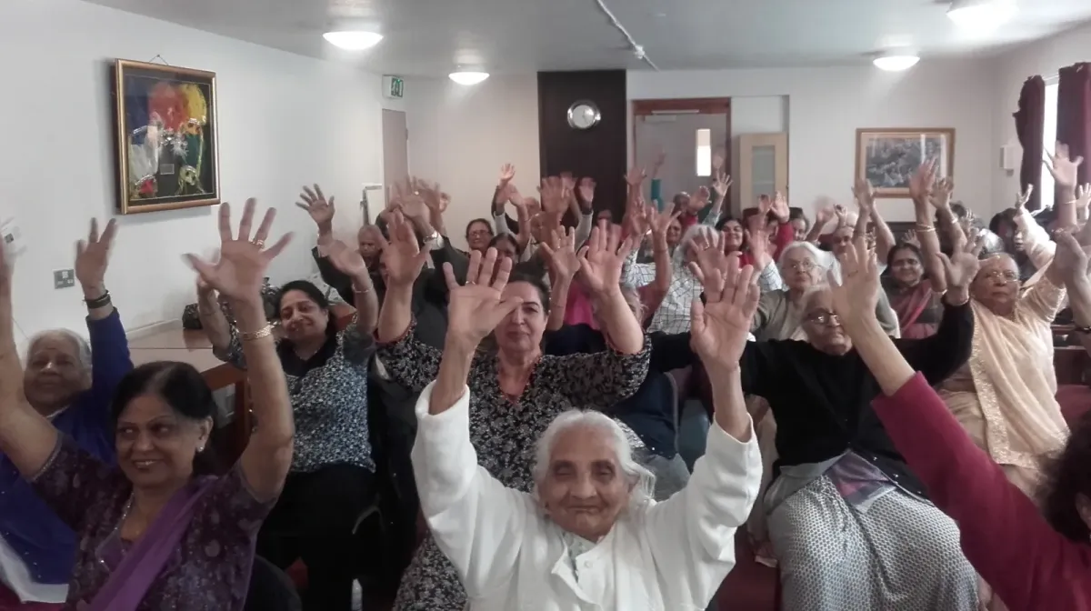 Peter teaching a Qi Gong Class in Milaap to a full house