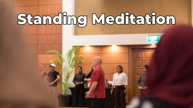 Peter teaching a Qi Gong Class in the Maldives with a standing meditation