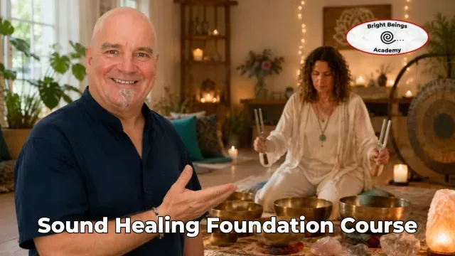 Peter showing a woman how to use a tuning fork in the sound healing foundations course