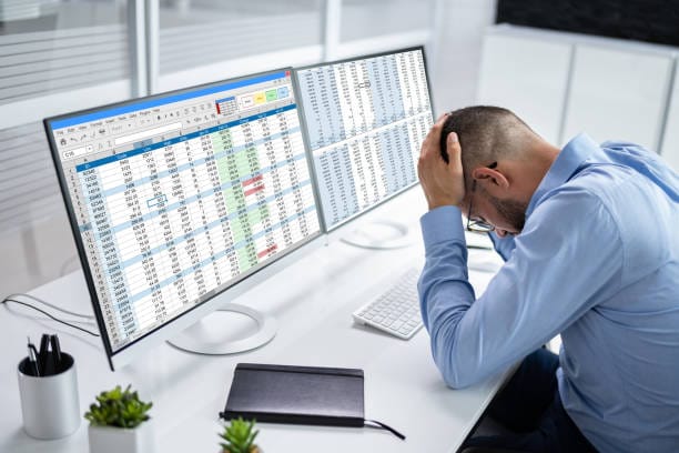 Overworked tax professional at desk