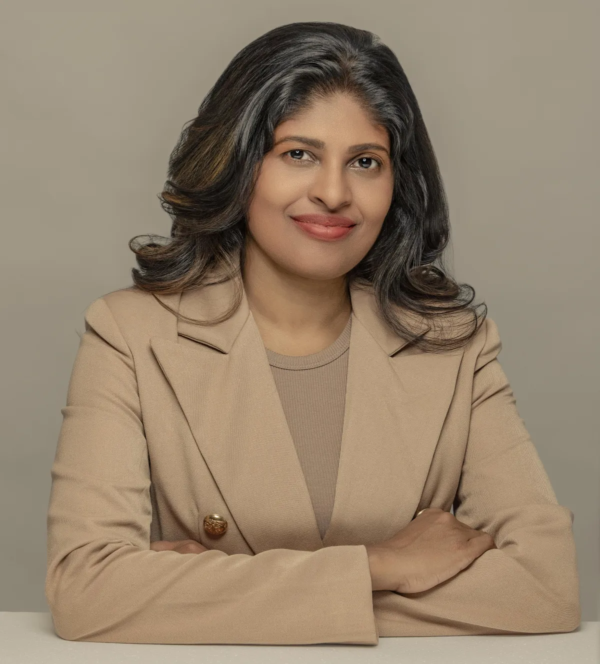 a woman sitting at a table with a piece of paper in front of her