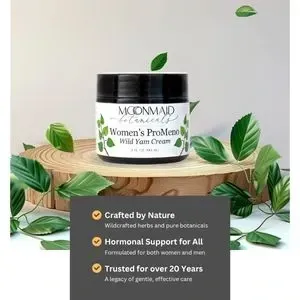Jar of Women's Moonmaid Wild Yam Cream on a log slice, surrounded by leaves, with text about natural crafting and hormone support for over 20 years.