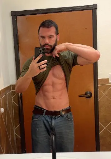 After photo of Genesis Method founder Don-E Harris showing the results of the program with a lean, sculpted six-pack abdomen.