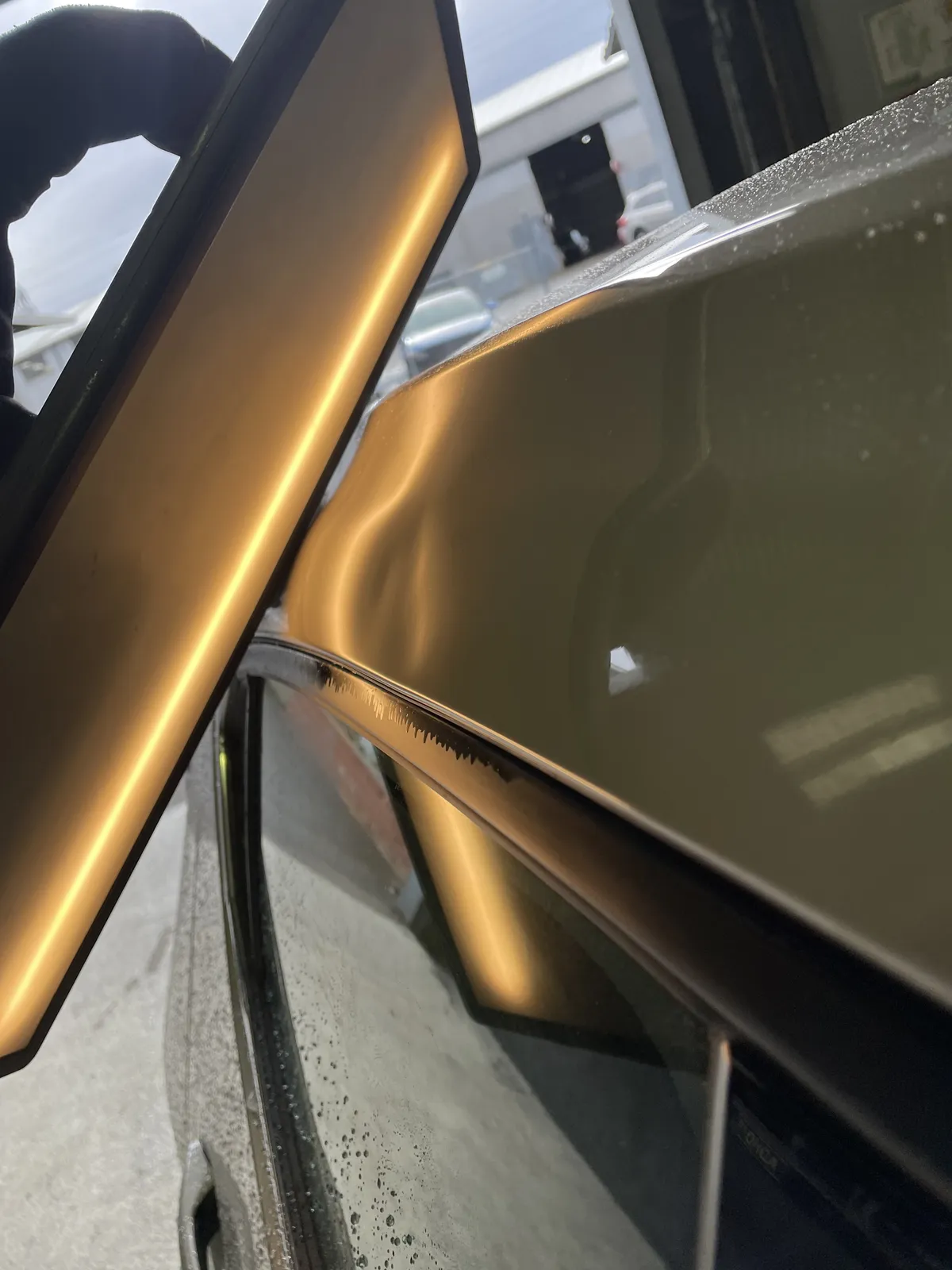 dent in side panel of work car