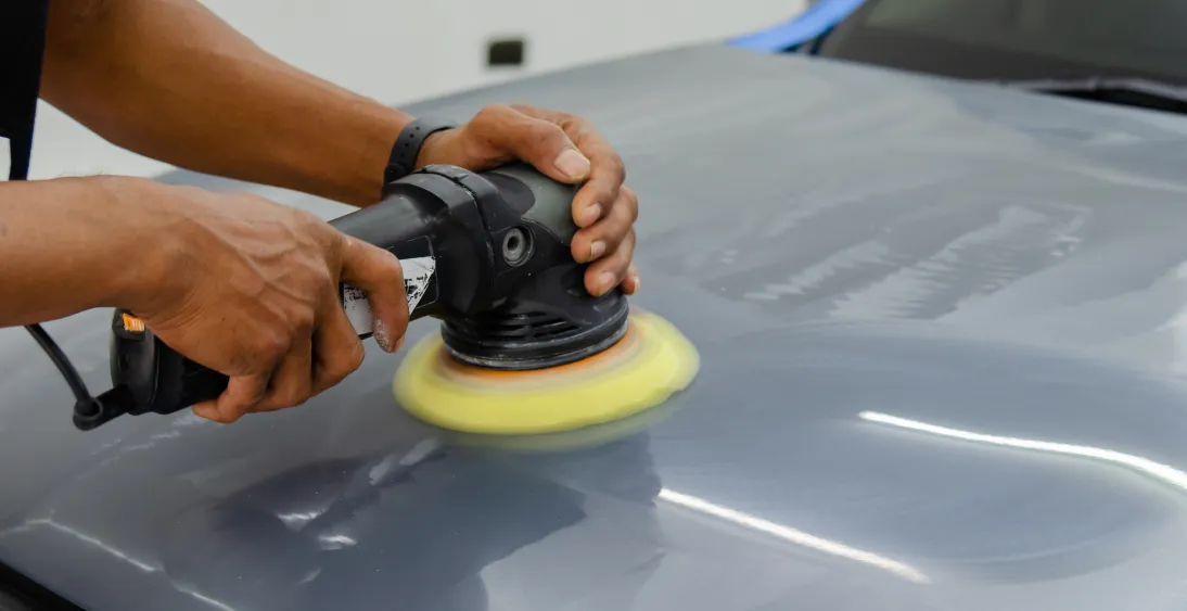 dent in side panel of work car