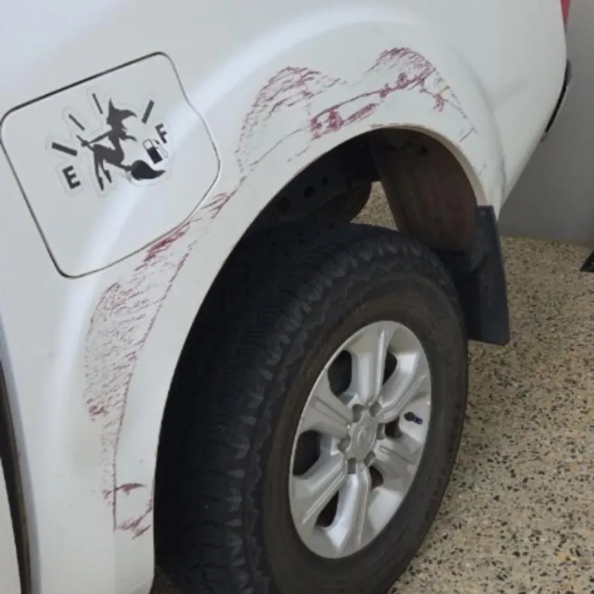 White ute with scuff marks