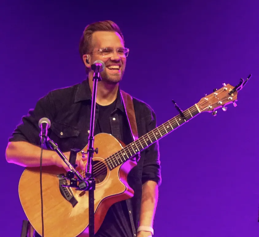 Josh Wilson playing live at a music festival