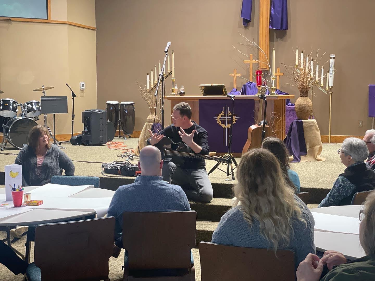 Jason Gray talks with guests at a Meet & Greet before a church concert