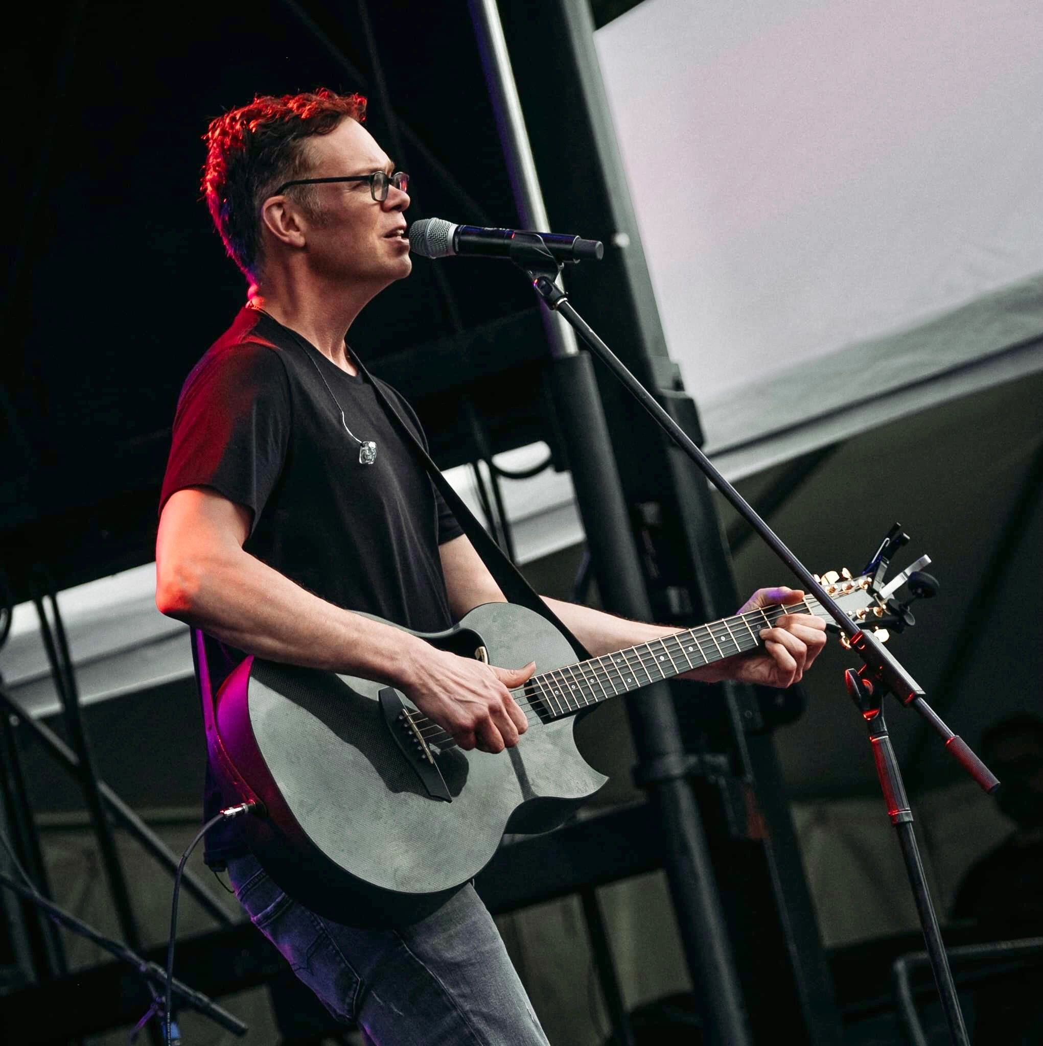Jason Gray playing live at a music festival
