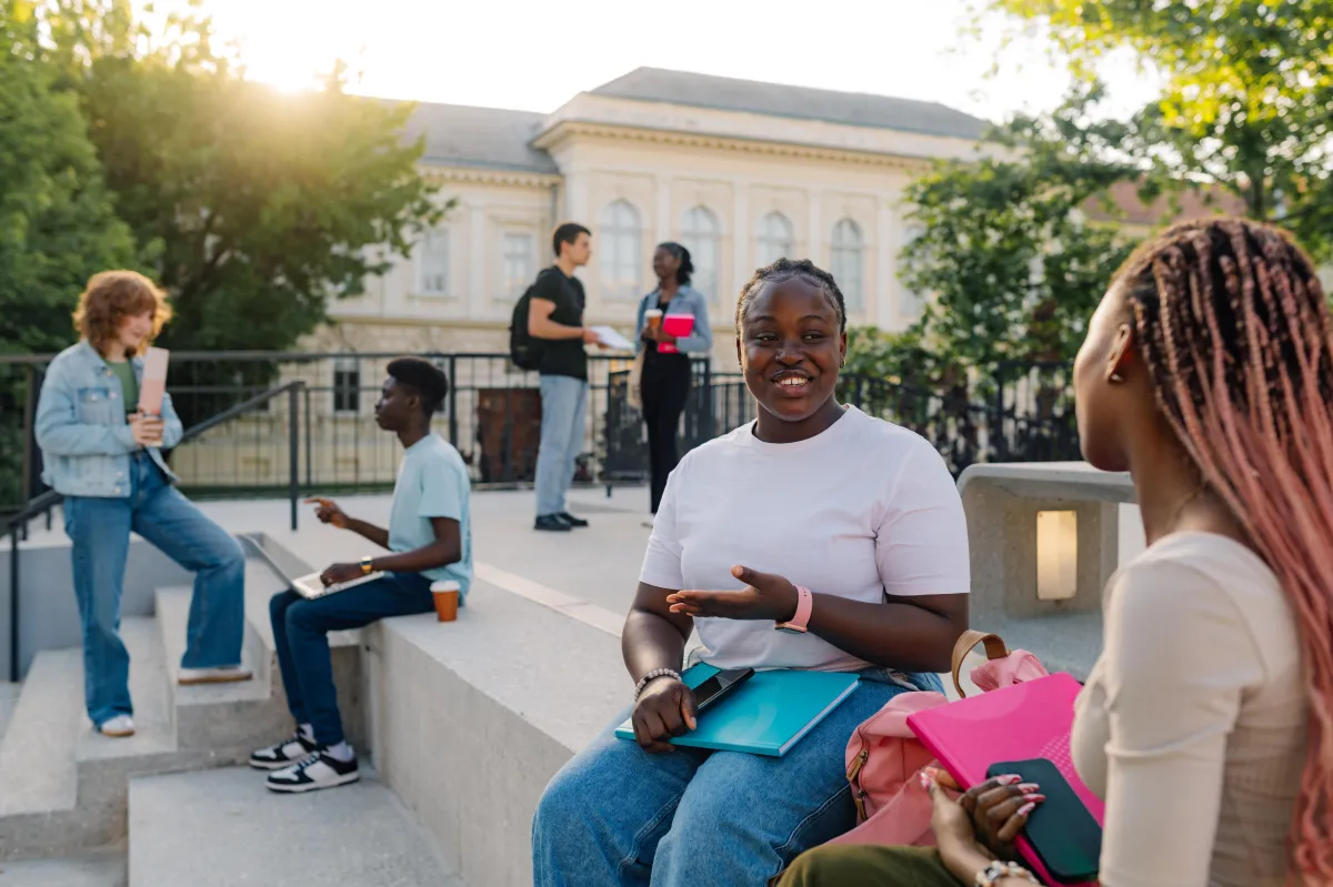 young college students chatting outside