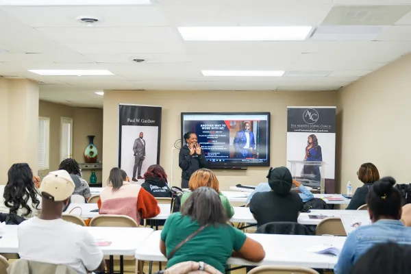 Participants learning during an assisted living business bootcamp focused on senior care, leadership, compliance, and building successful assisted living communities.