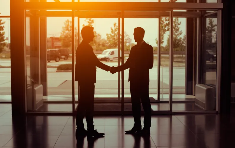 Two businessmen shaking hands 