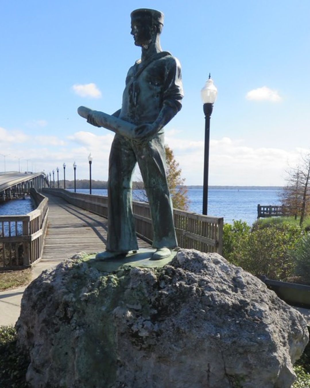 bronze sailor statue along the Palatka Riverfront overlooking the St. Johns River, representing Putnam County history for the Putnam Locals directory.